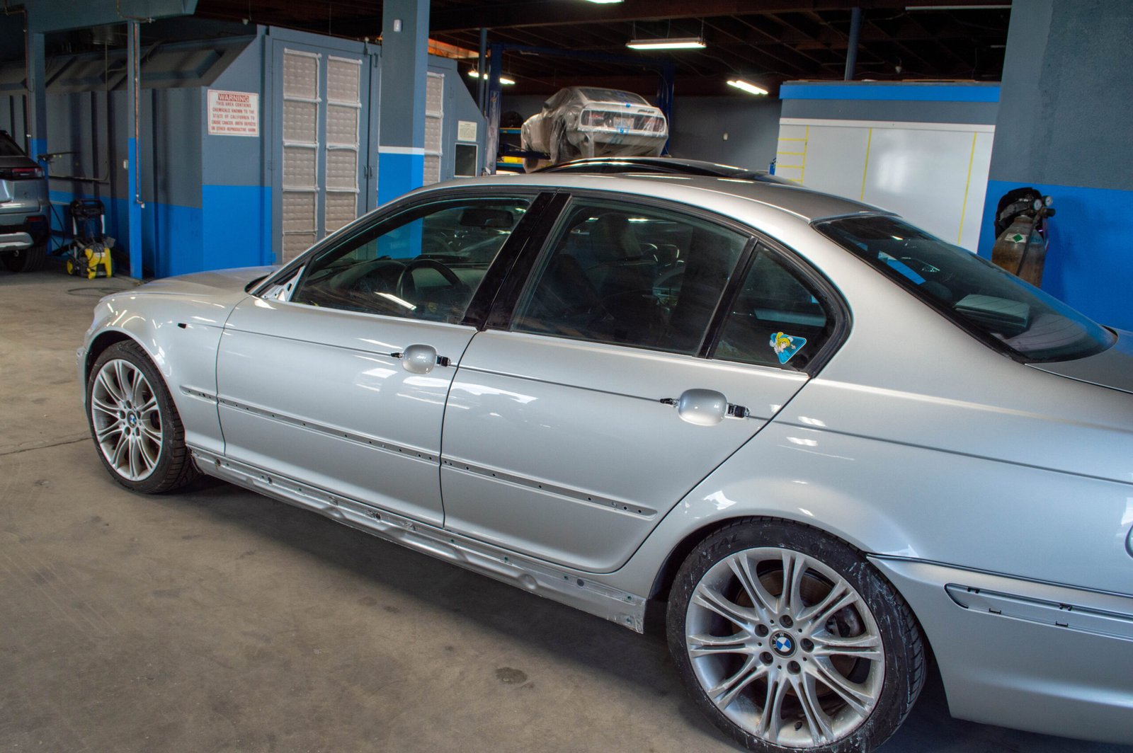 Dent removal before and after — driver door restored to factory condition