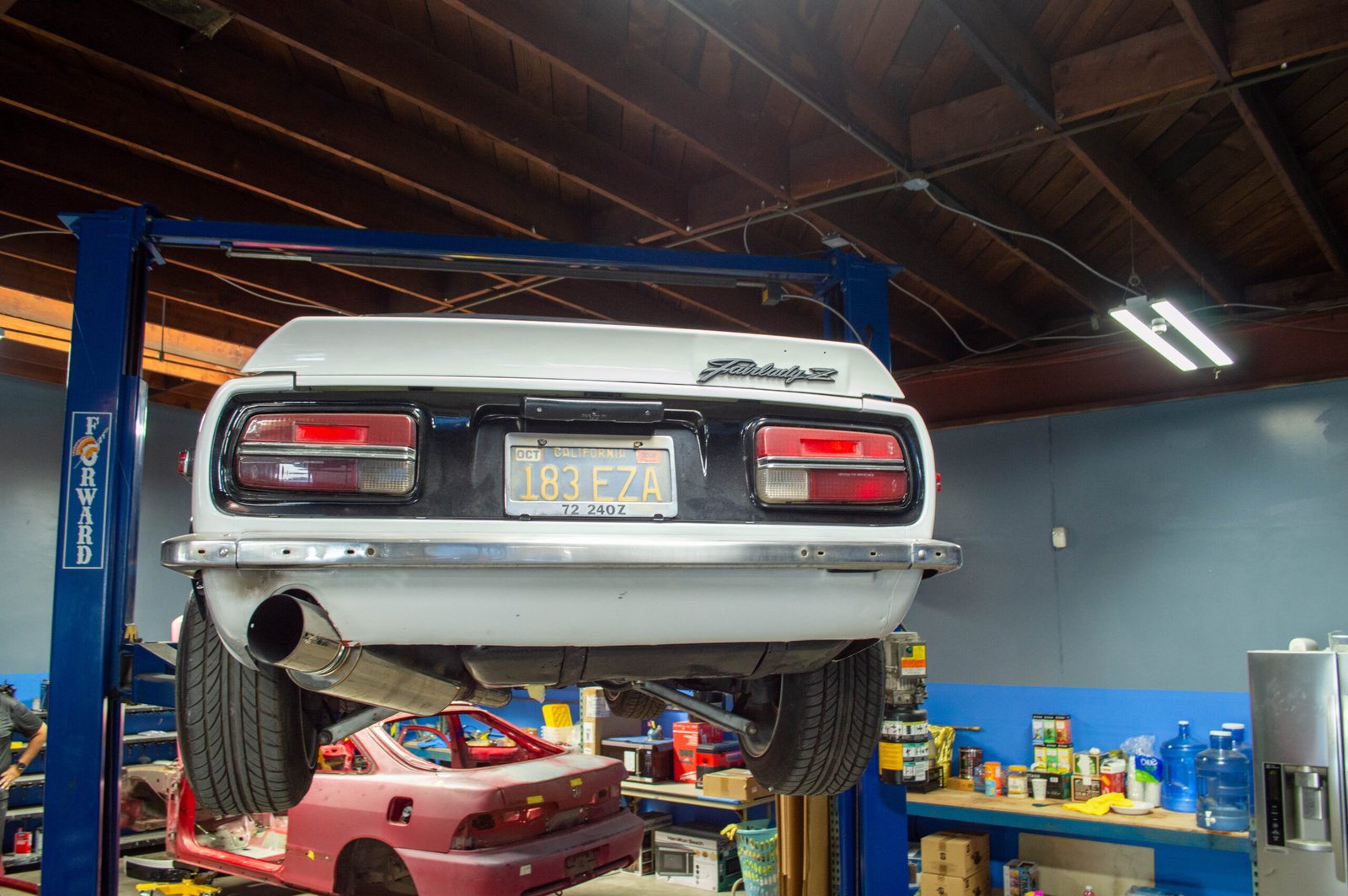 Rear-end collision repair — bumper and trunk lid replacement and refinishing